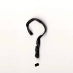 Image of a black question mark on a white background for an article about determining if it’s better to rent or buy a stairlift.